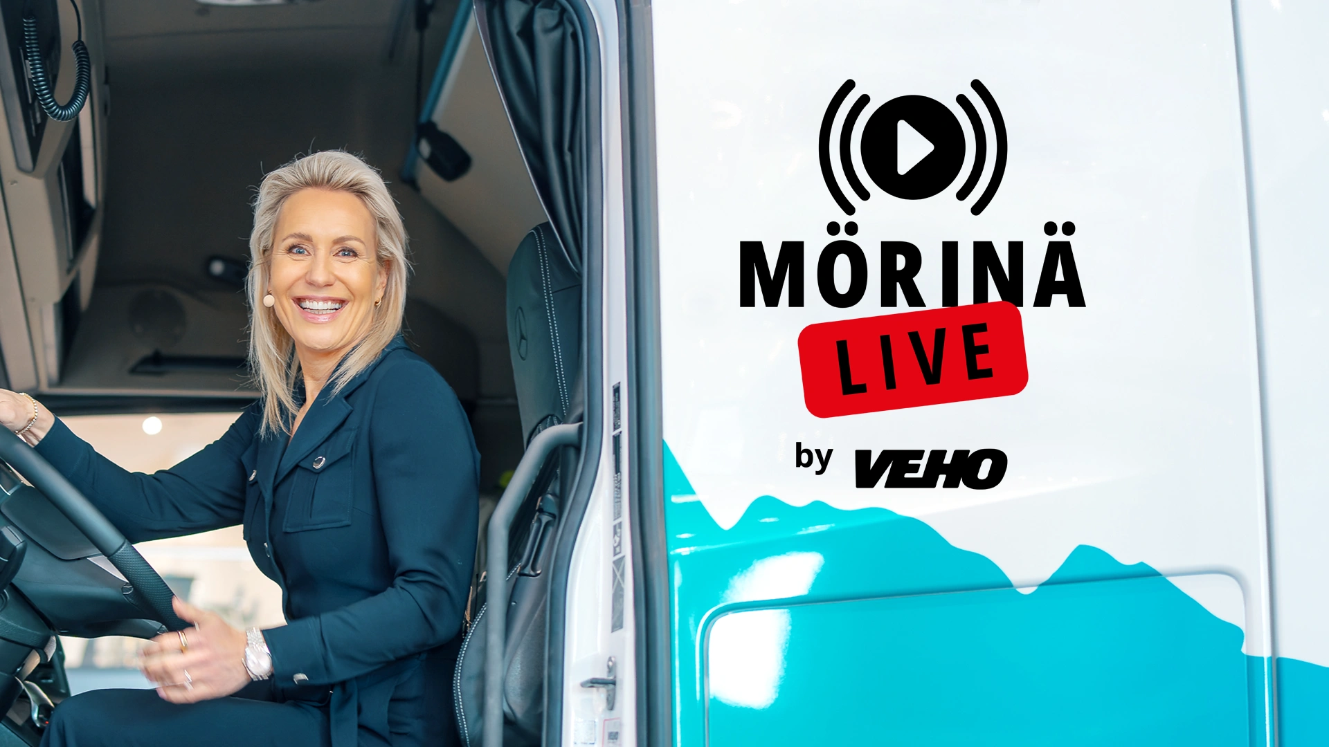 Mervi Kallio istuu kuorma-auton ratissa